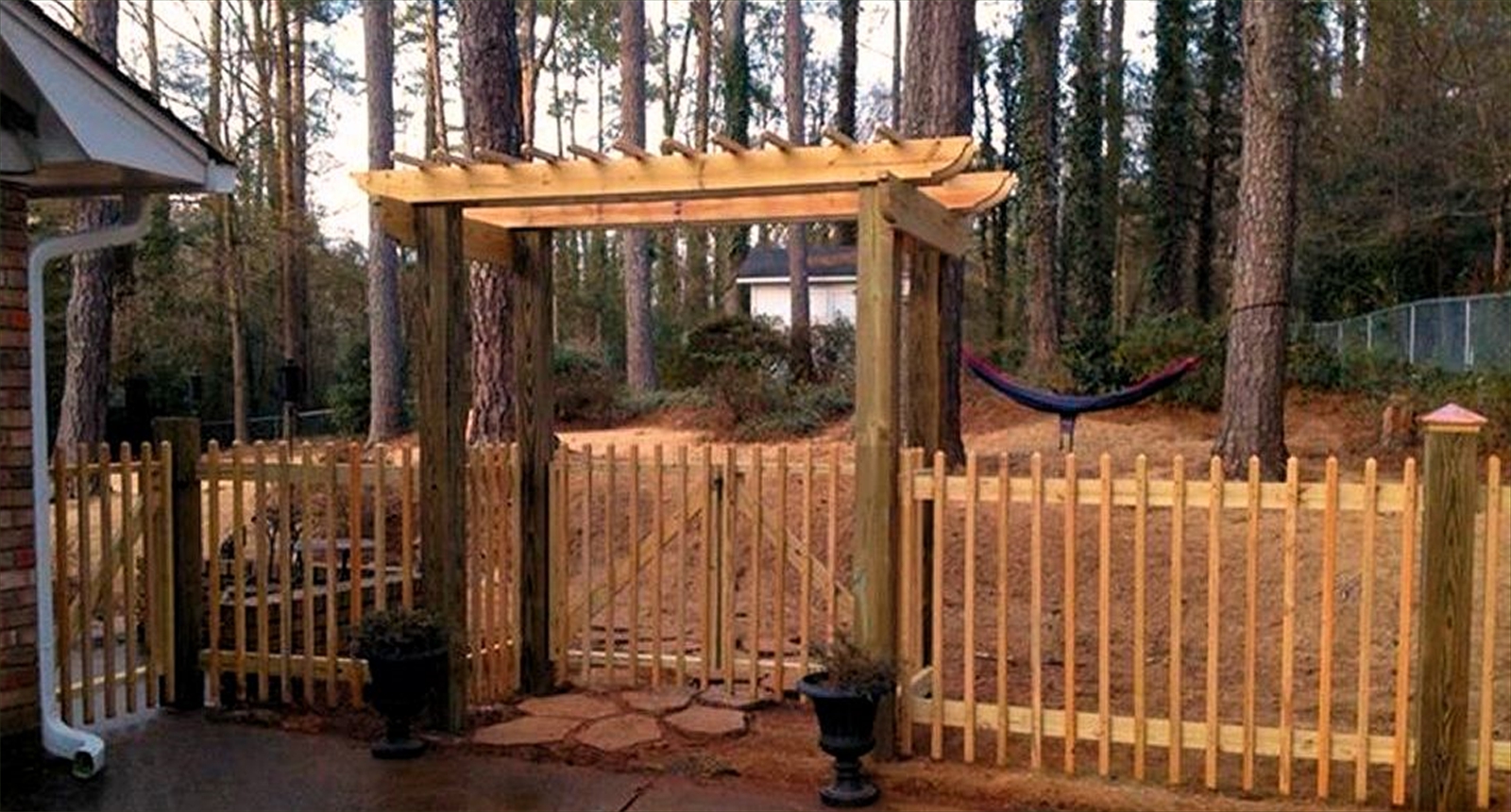wood fence, arbor, and gate